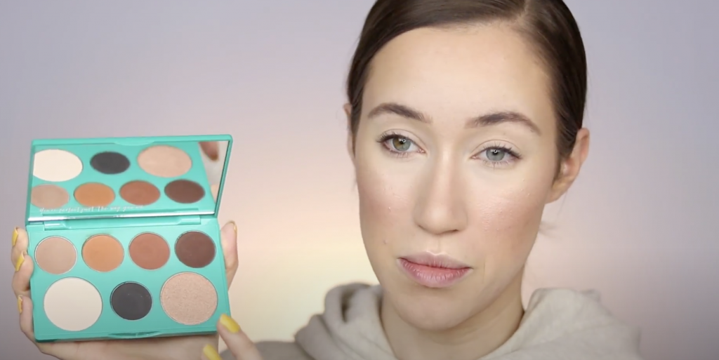 woman applying thrive causemetics make up