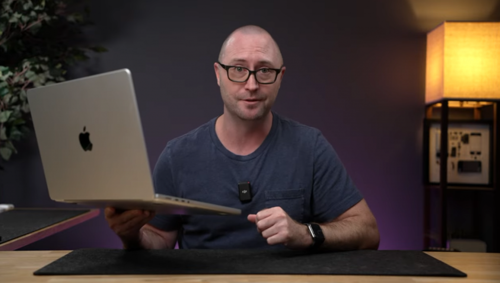 men holding MacBook pro 