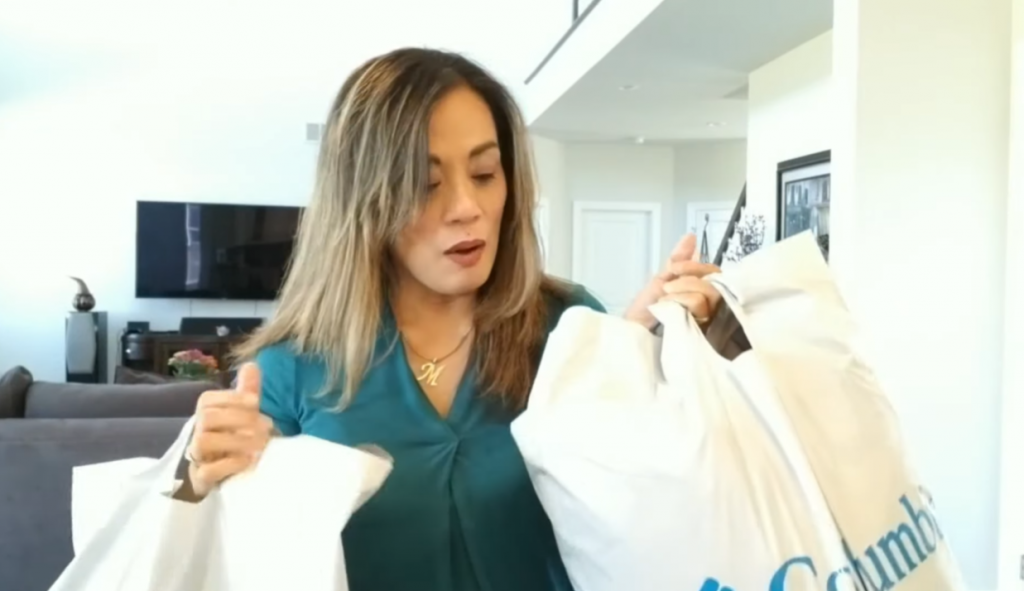 Women holding columbia white bags