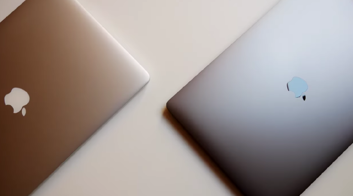 high angle shot of 2 apple MacBooks  on a table