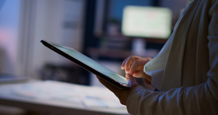 close up of hands using a tablet