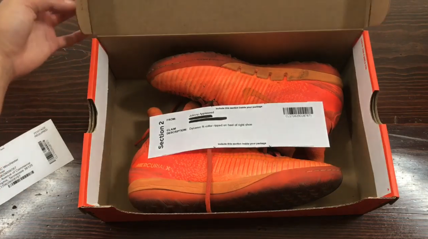 worn orange nike shoes in their box