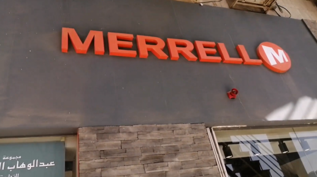 merrell store logo sign on wall
