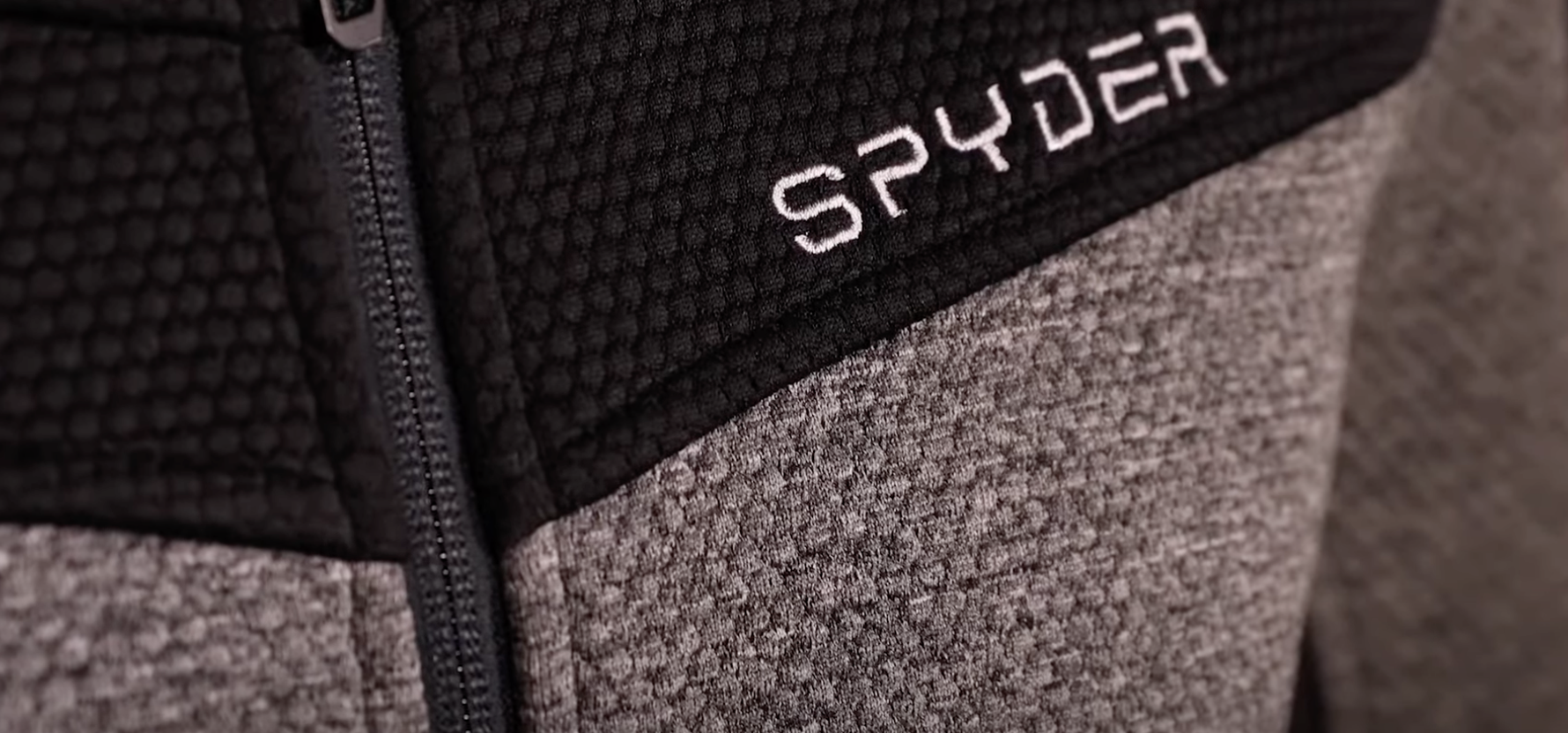 gray jacket with black spyder