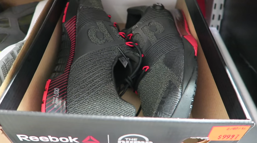 black and red reebok shoes in their box