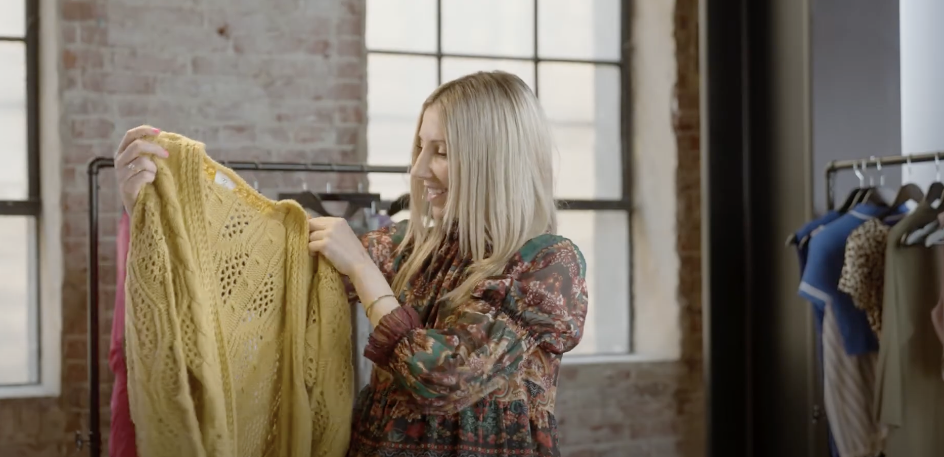 blonde woman holding yellow...