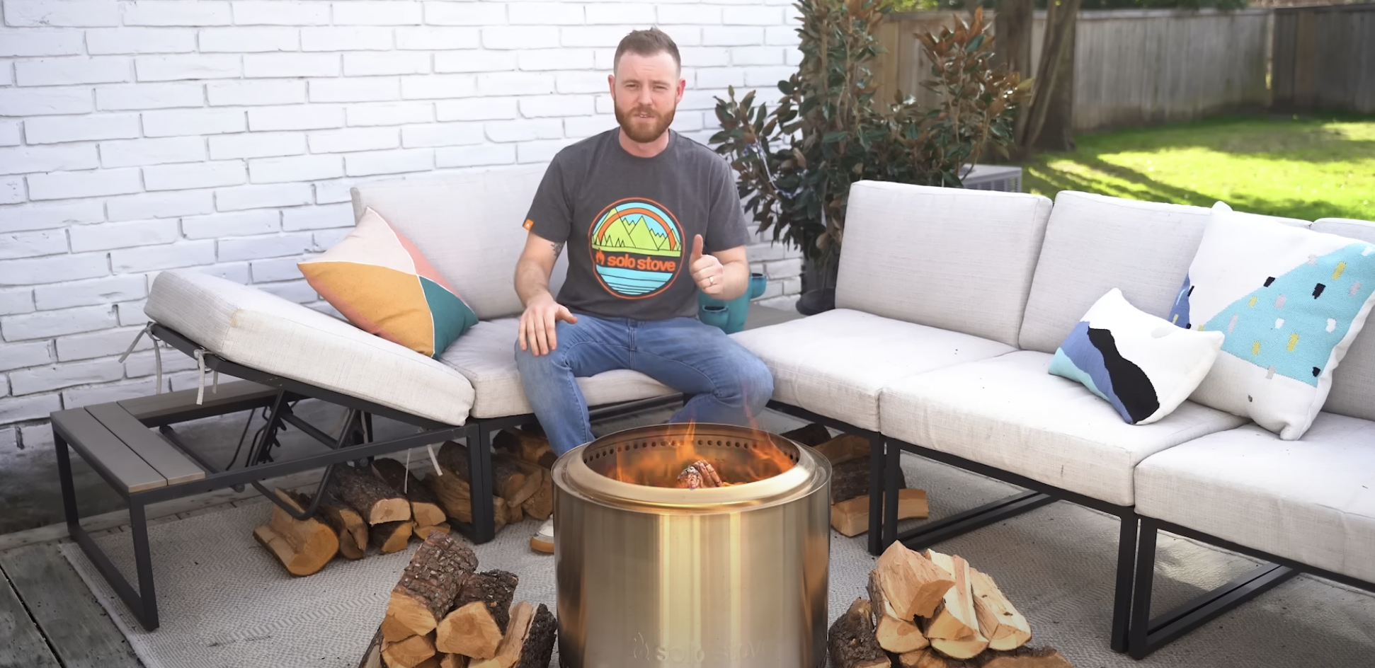 men with fire pit lit in the garden