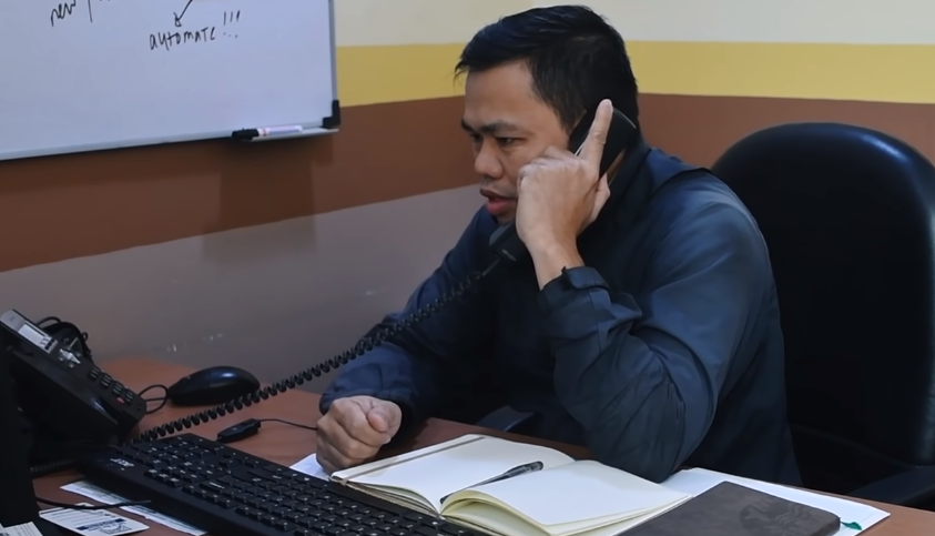 customer service man on a call in his office
