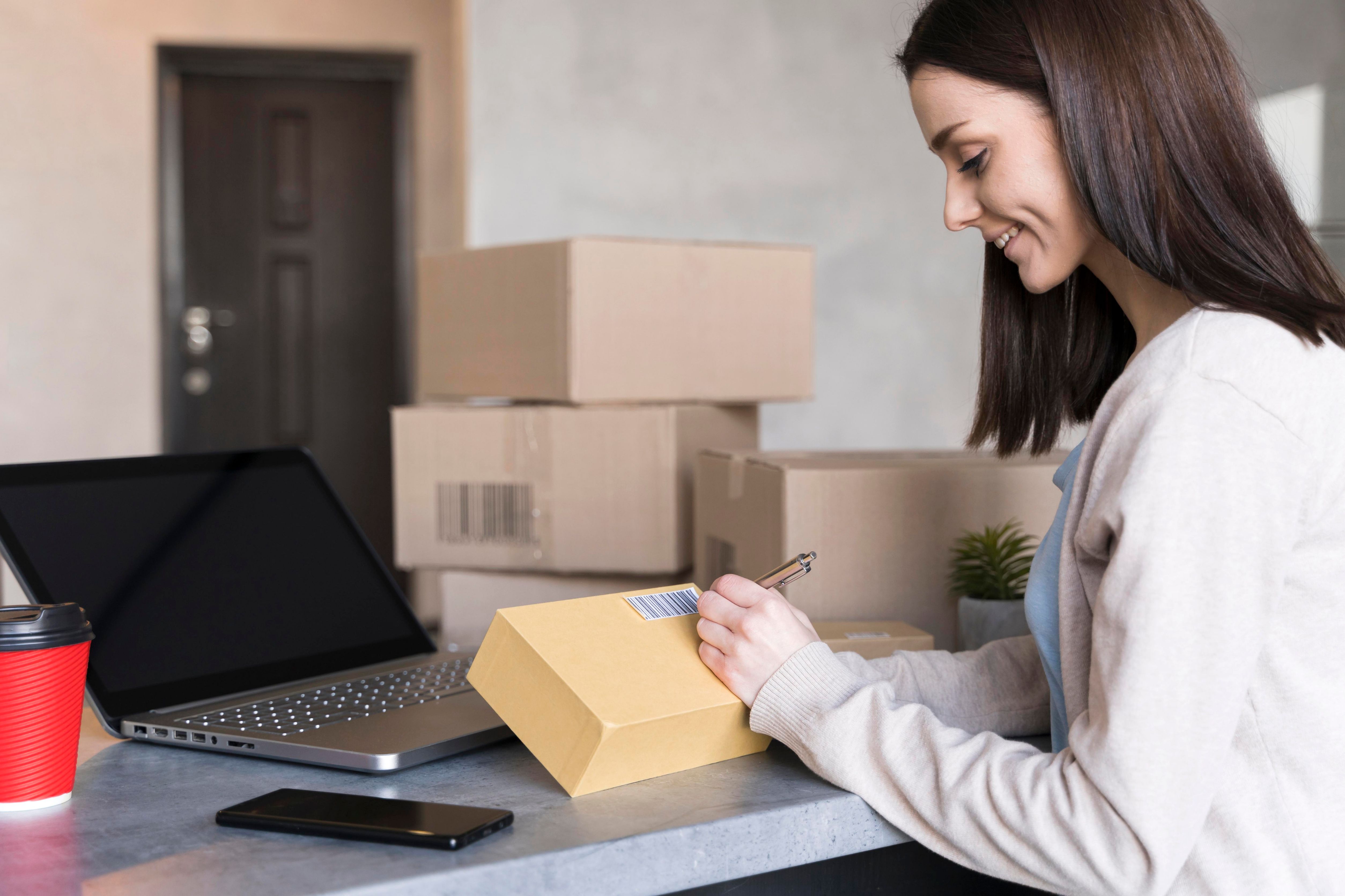 girl assembling boxes retur...