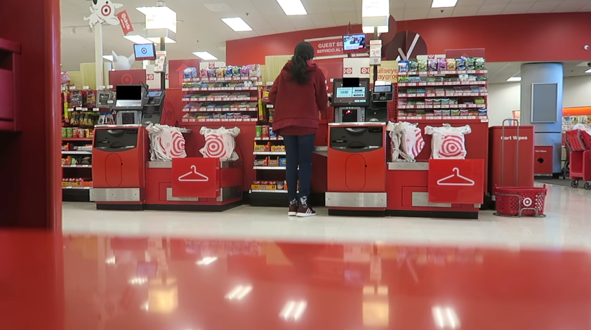 Young Target worker at checkout