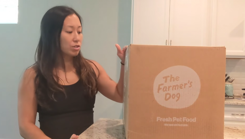 asian women with the farmers dog box