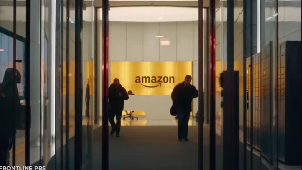 Amazon warehouses entrance with 2 men standing
