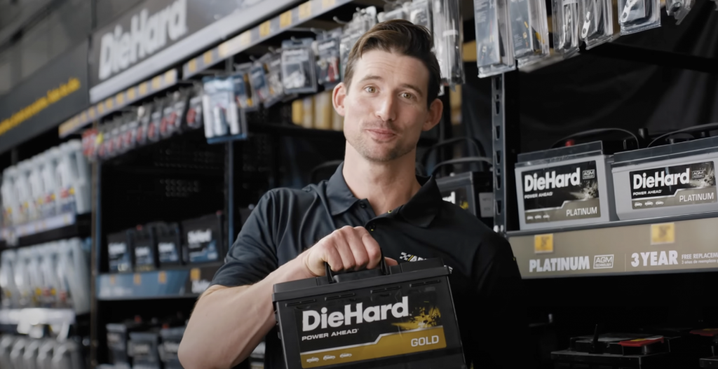 man holding car battery
