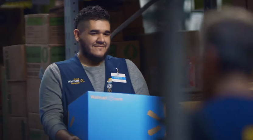 Walmart worker holding a Walmart box
