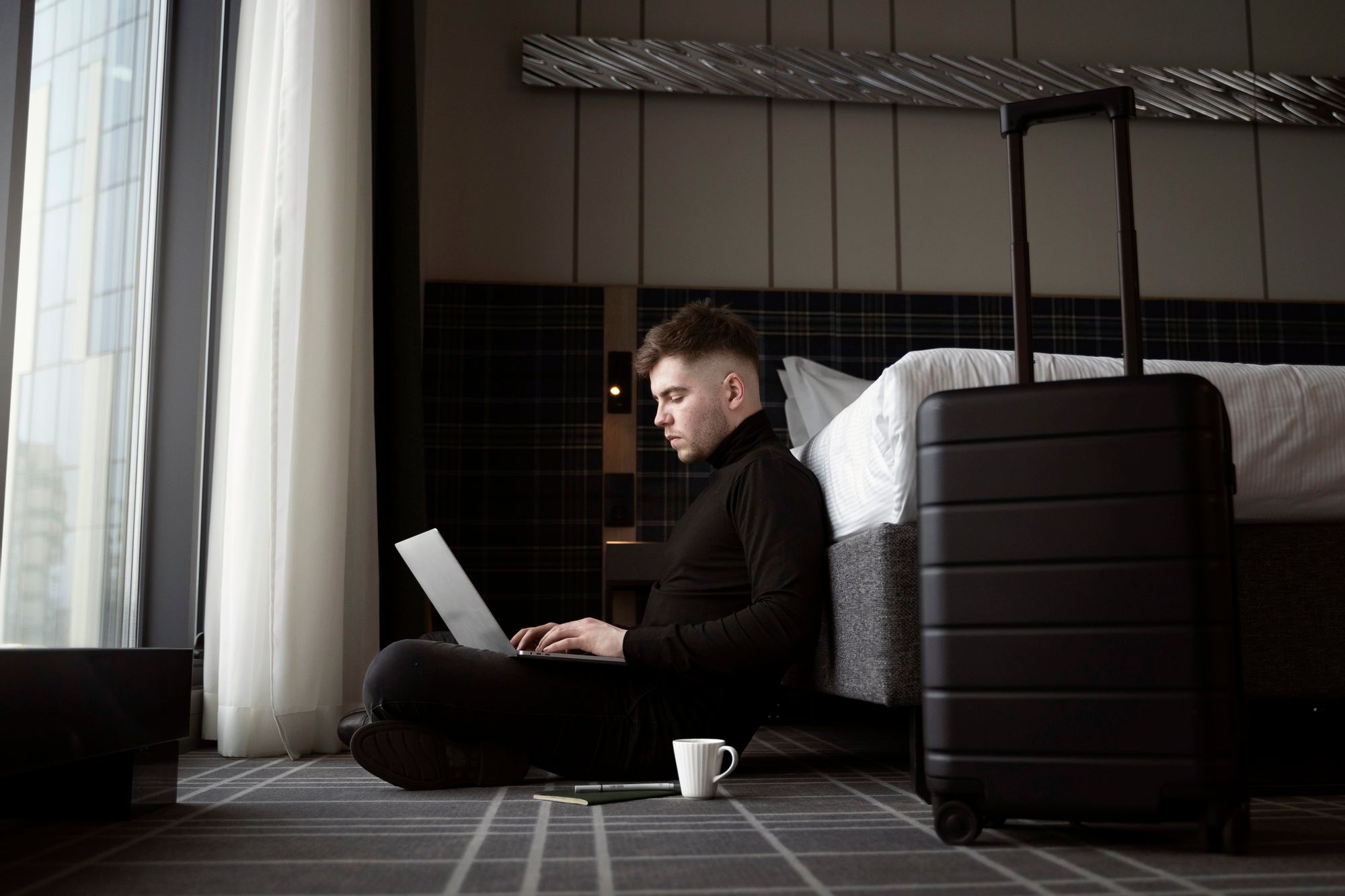 boy using laptop sitting on...