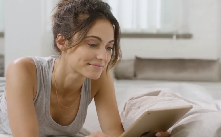 woman with white tablet contacting ThirdLove tech support