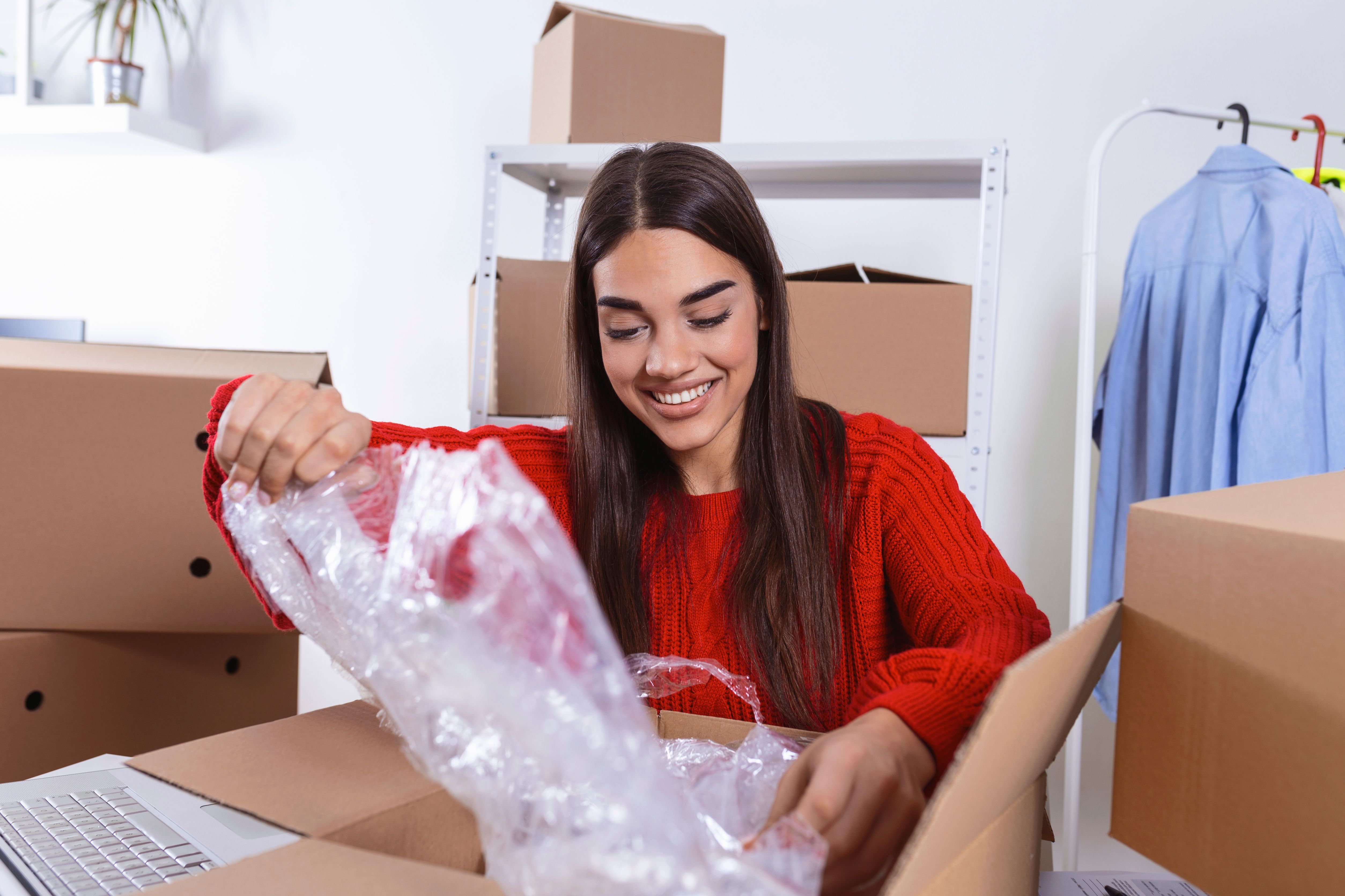 girl in red sweater packing...