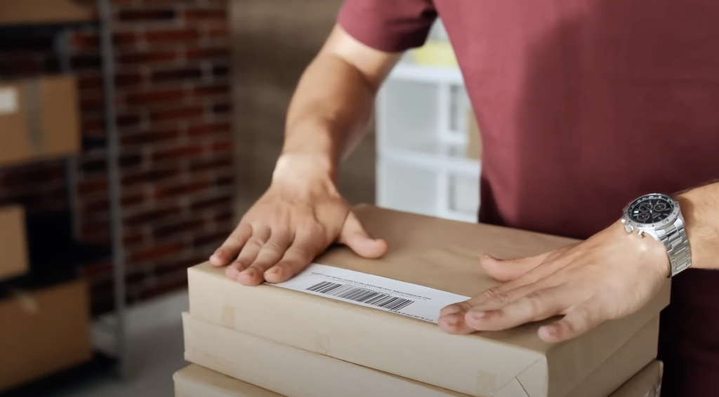 man-hands with watch labeling box-return purchase-return policy-purchases