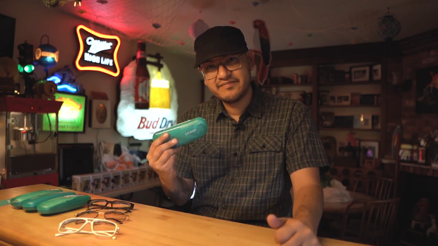 man holding a zenni glasses case