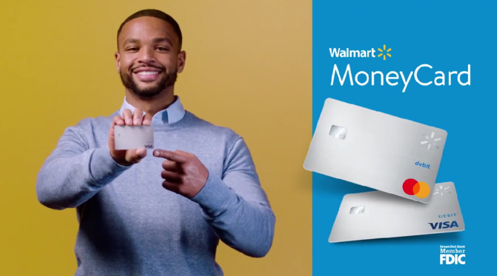 man with yellow background showing MoneyCard