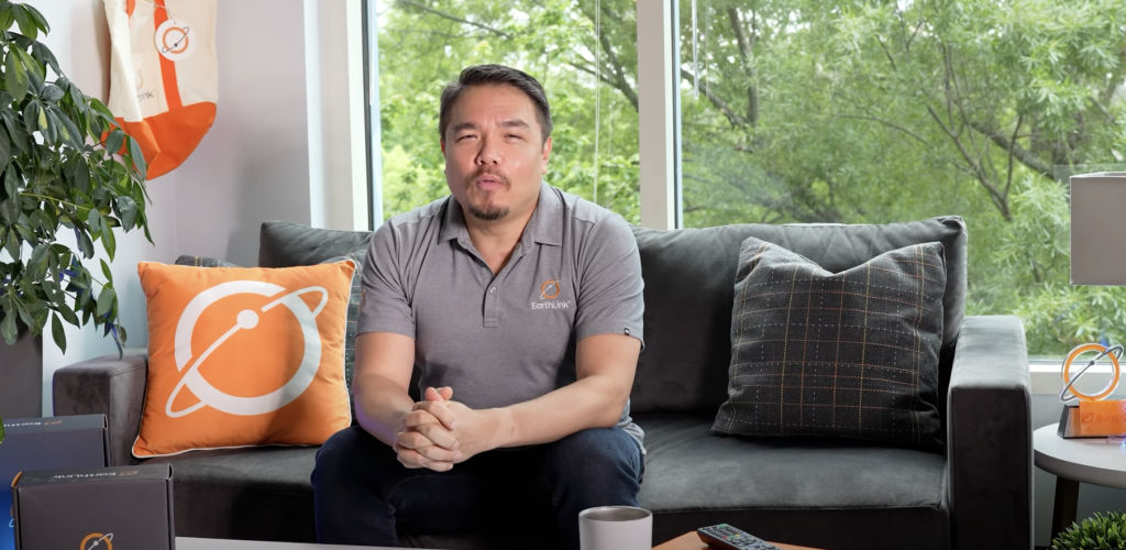 Man sitting down giving a review of EarthLink