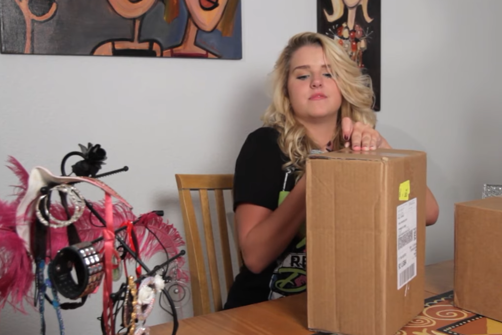 girl checking dancewear solutions box