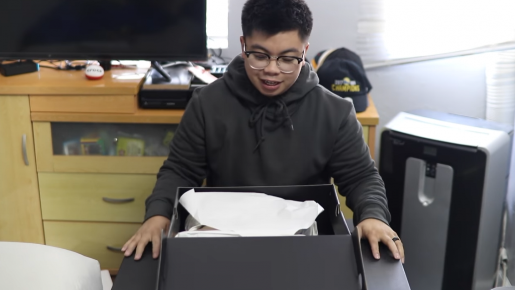 asian boy unboxing 