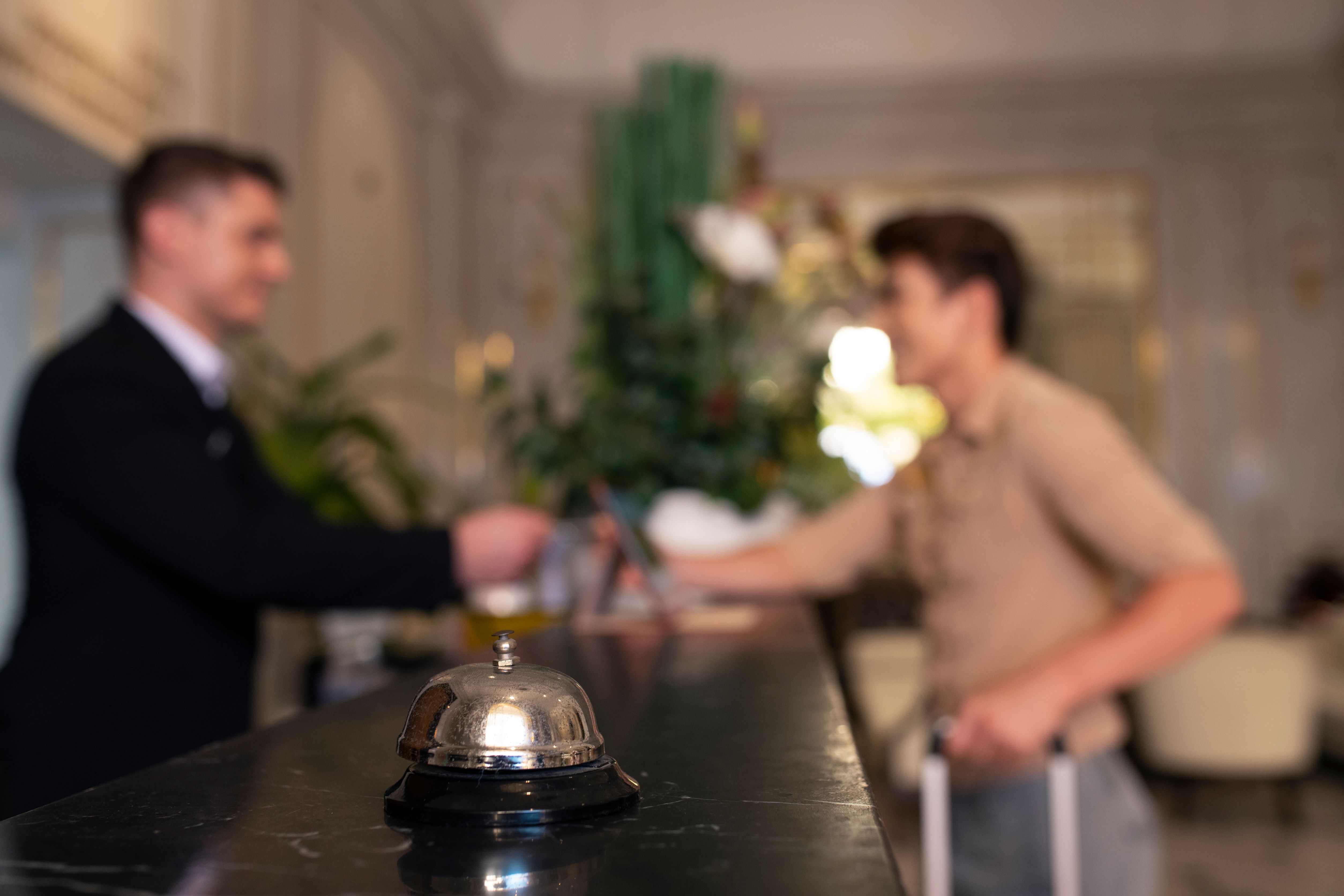person checking into hotel-...