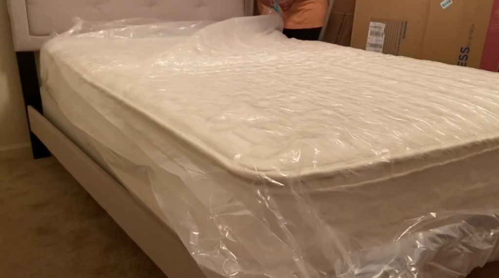 Mattress with plastic wrap