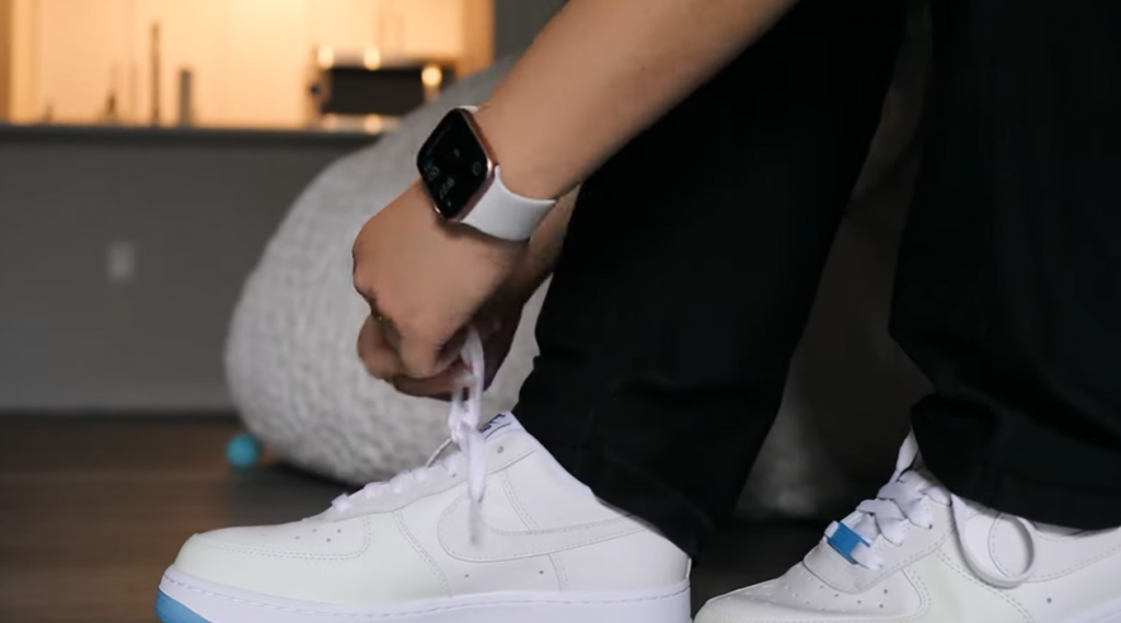 boy tying his nike uv Air Force laces