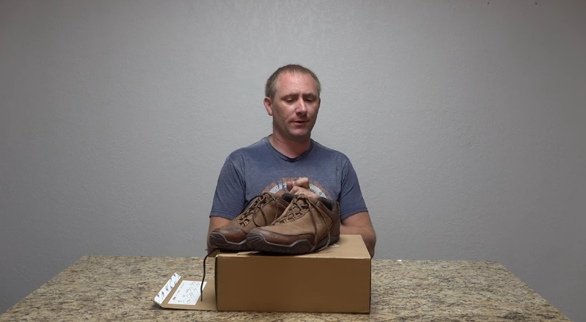 man looking at kuru chicane trail hiking shoes