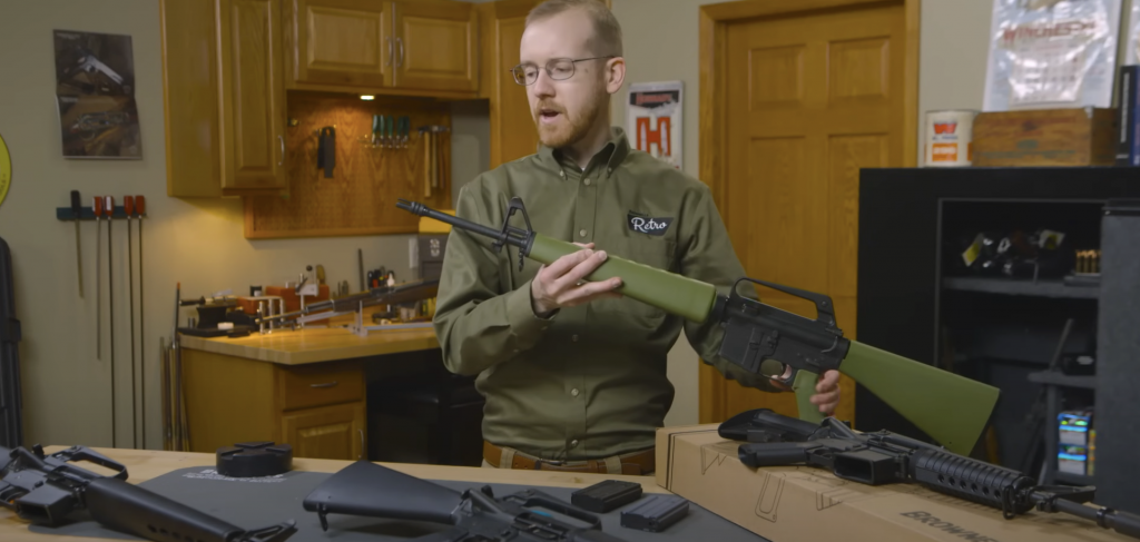 man showing gun-brownells firearm accessories-gun parts