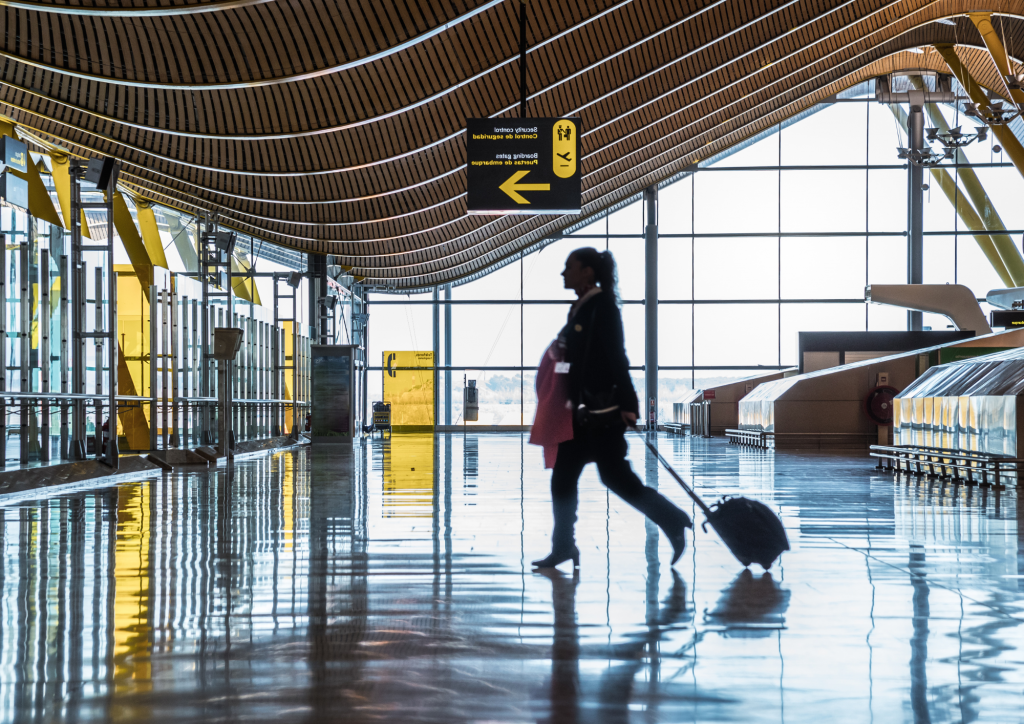 airport terminal with people moving silhouettes and sunray-malasya airlines return policy