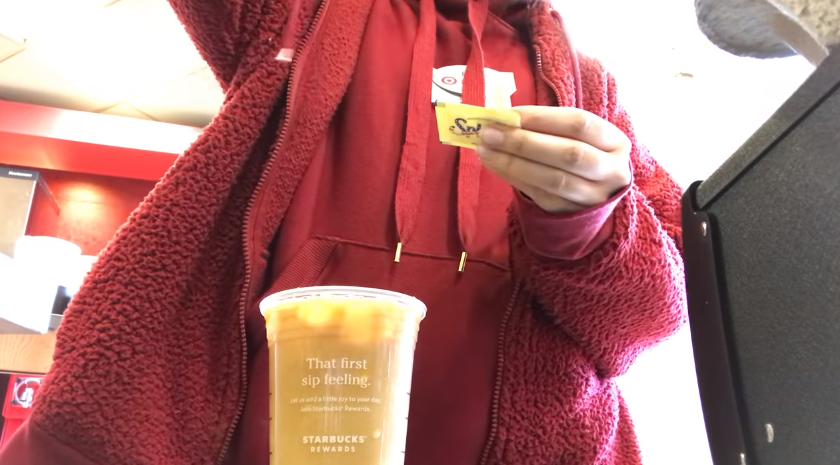 Target worker serving coffee