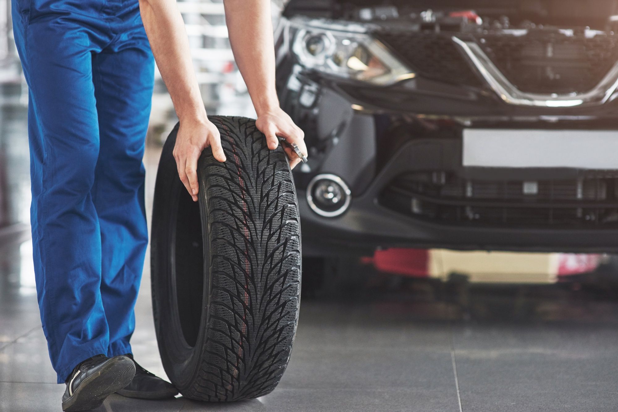 mechanic rolling tyre-car-n...